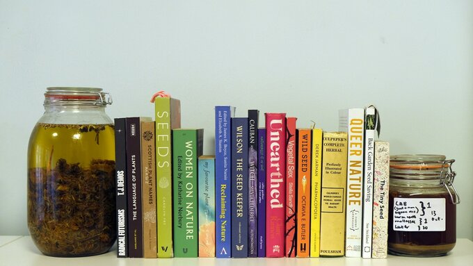 A shelf of colourful fiction, nonfiction and poetry books.
