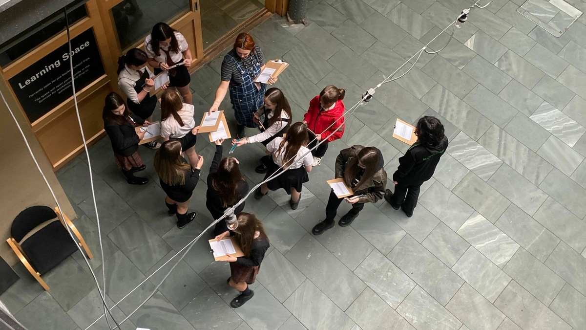 An overhead photo of school kids outside the CCA learning space.