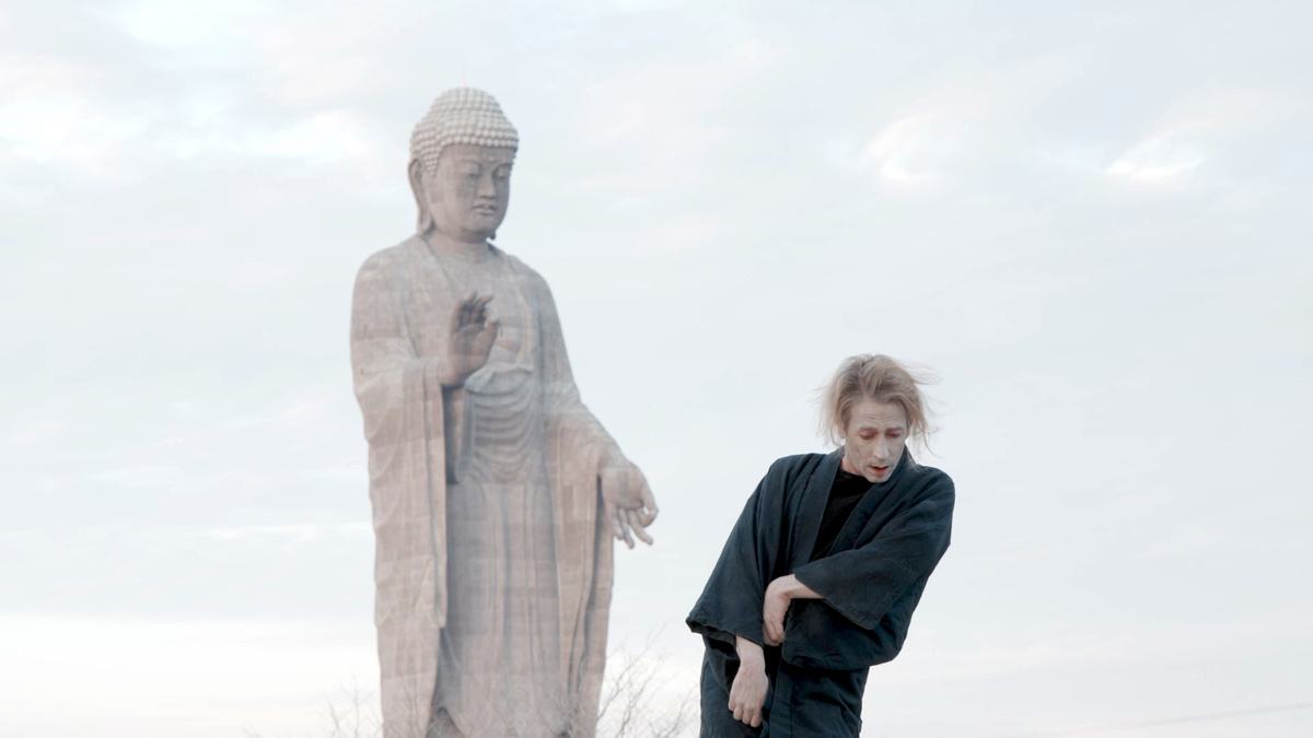 First image ('Buddha.jpg): A dancer outdoors in a kimino with painted face, beside a huge Buddha statue.