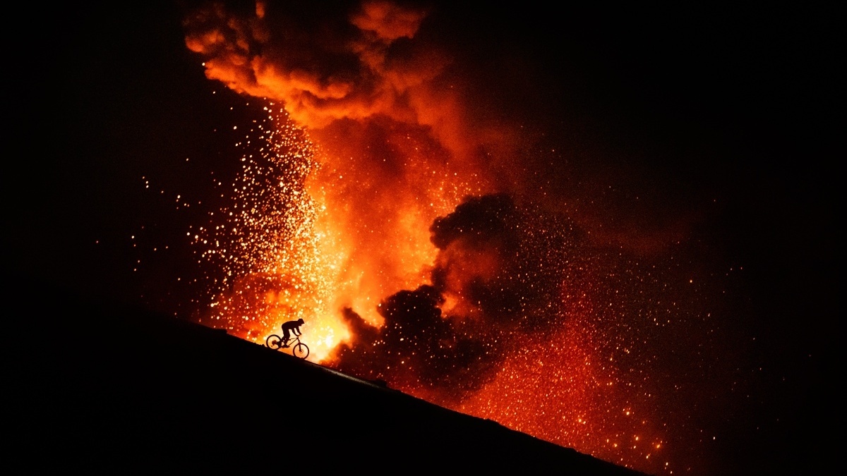 A rider going down the side of an active volcano in Guatemala .