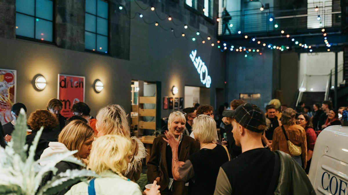 Busy party environment at the Centre for Contemporary Arts, Glasgow with SQIFF projected onto the back wall.