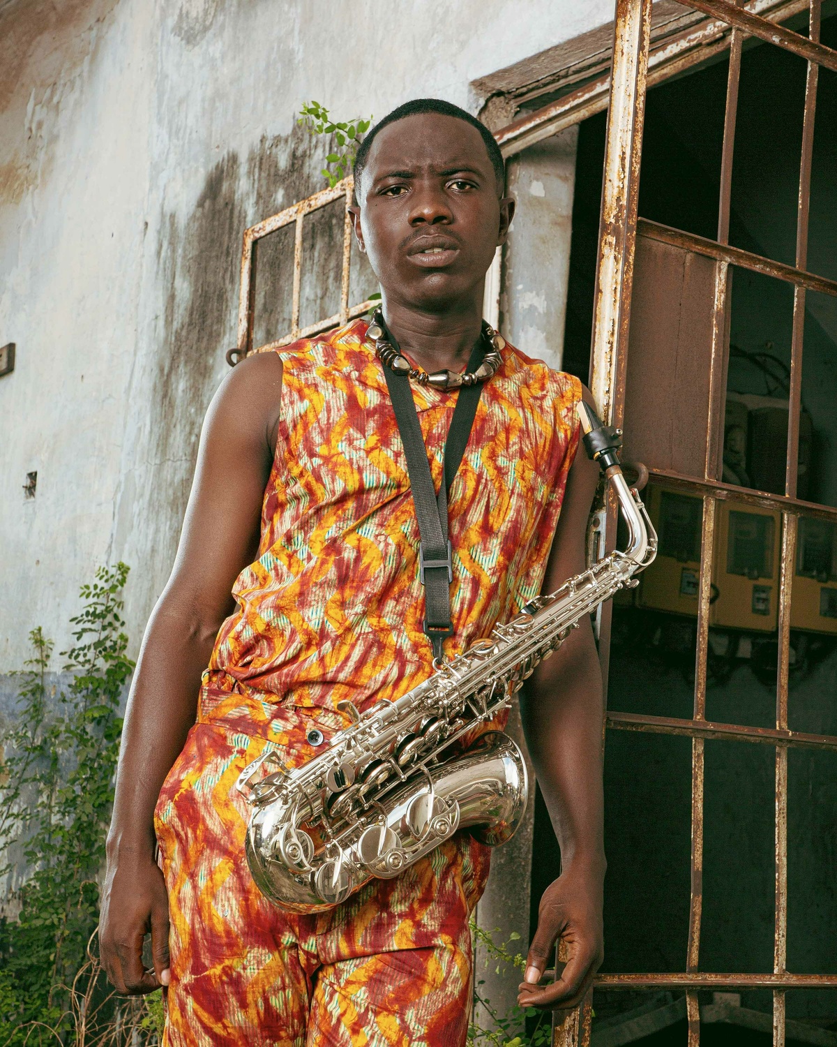 A person holding a saxophone.