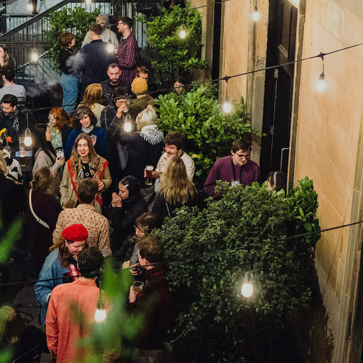 The terrace bar of Third Eye Bar is full of people, animatedly talking.