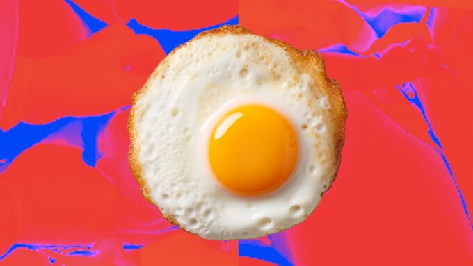 An abstract, hot and cold, sunset as background; with a fried egg (sunny side up) sitting proudly in the middle of it.